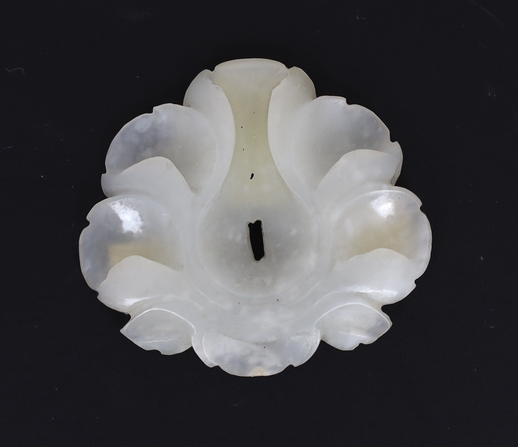 A Chinese small white jade flower head, Song/Yuan dynasty, 12th/13th century